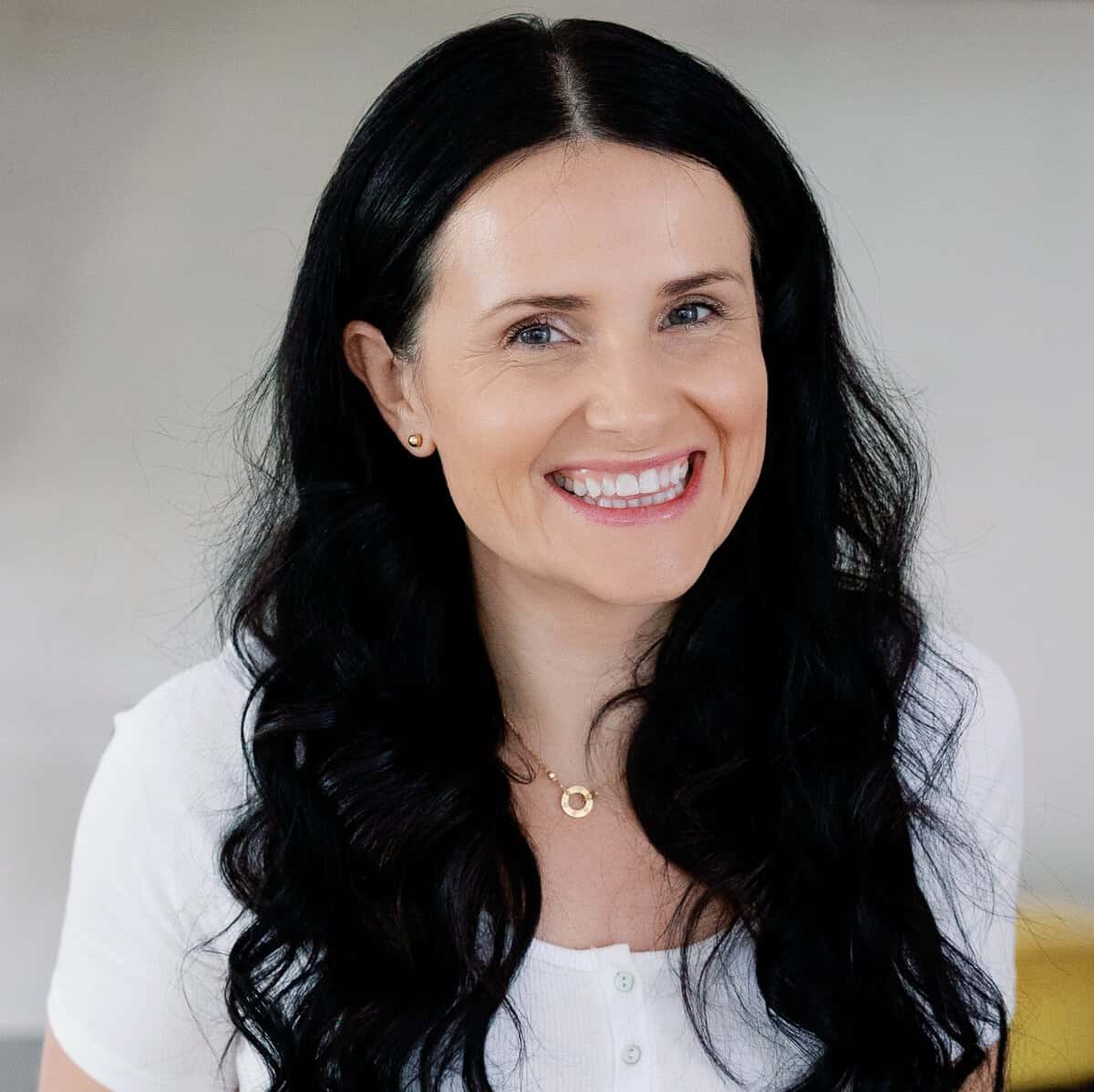 Natalya Drozhzhin in white shirt