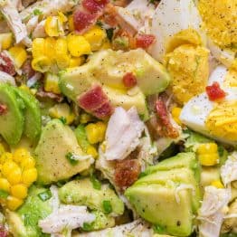 This Avocado Chicken Salad recipe is a keeper! Easy, excellent chicken salad with lemon dressing, plenty of avocado, irresistible bites of bacon and corn | natashaskitchen.com