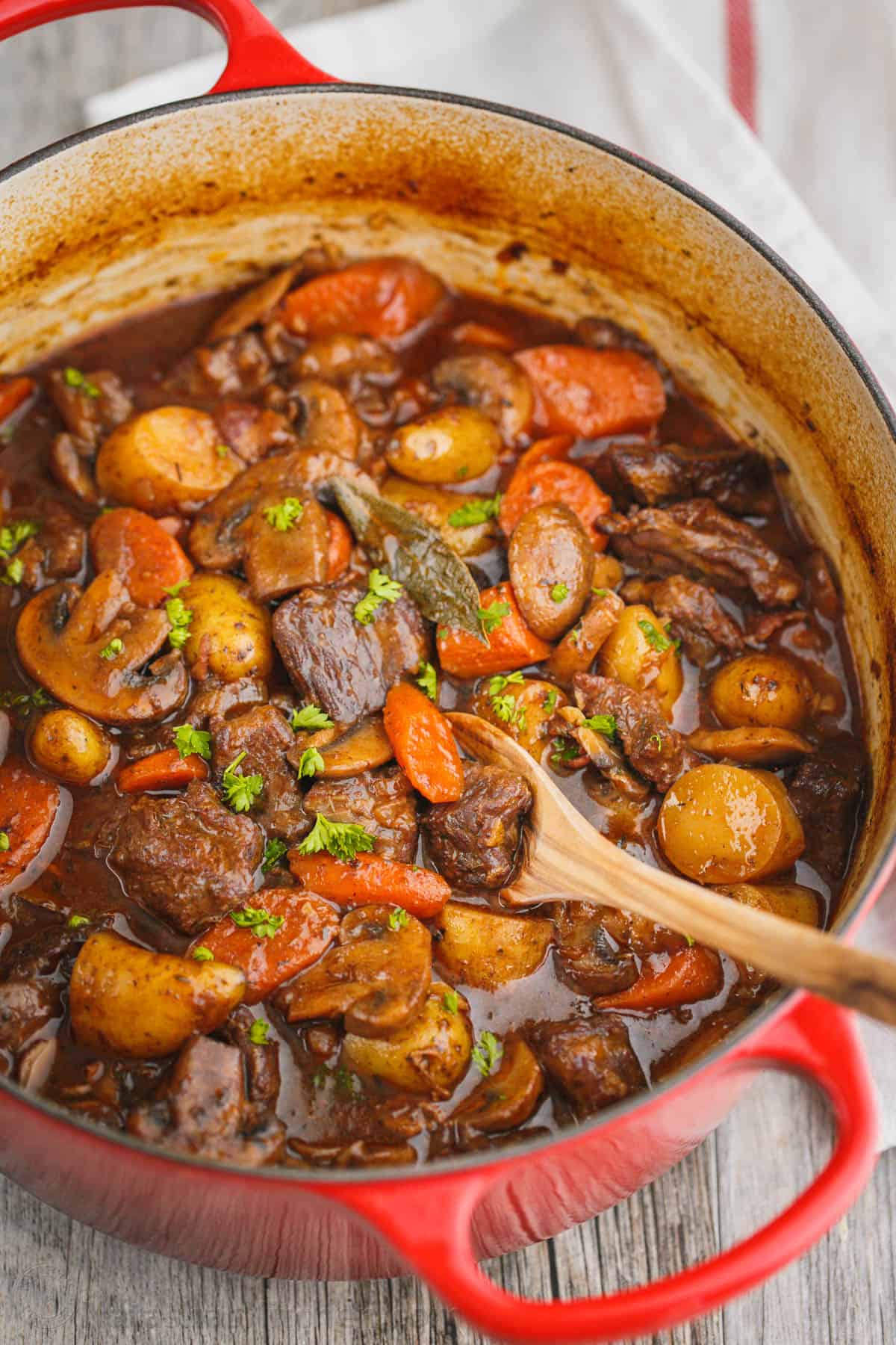 The beef in this homemade beef stew is so tender and just melts in your mouth! @natashaskitchenBeef Stew. Ok, yum! The beef is so tender and just melts in your mouth! #beefstew #beefstewrecipe #beef #beefbourguignon Beef Stew in a red pot