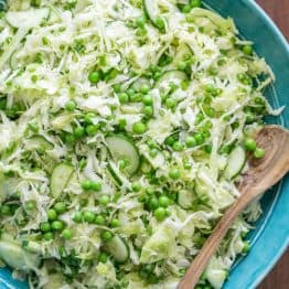 This cabbage and pea salad is vibrant, crisp and fresh. I love the sweet pop of flavor from the peas and the easy zesty dressing. A must try cabbage salad! | natashaskitchen.com
