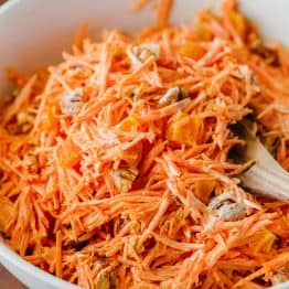 A simple and tasty carrot salad studded with apricots and pecans. The dressing in this carrot salad is delicious - you'll want it on all of your salads!
