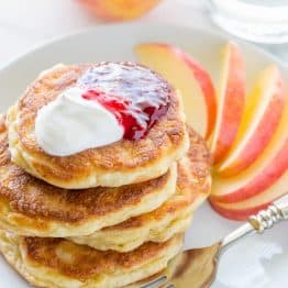 Apple and cheese pancakes are so light and fluffy. Serve these Ukrainian cheese pancakes with jam and sour cream for an unforgettable breakfast!