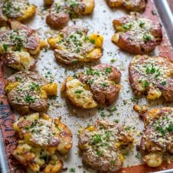Smashed potatoes on baking sheet