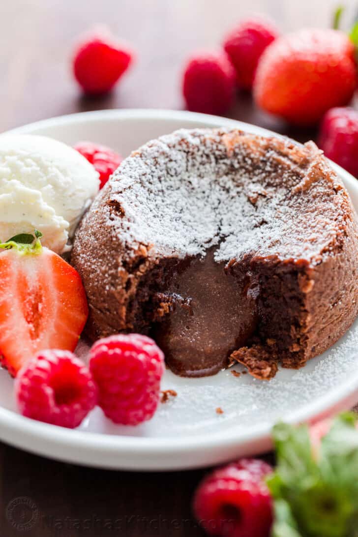 Chocolate Lava cake dusted with powdered sugar with molten center and served with ice cream and berries