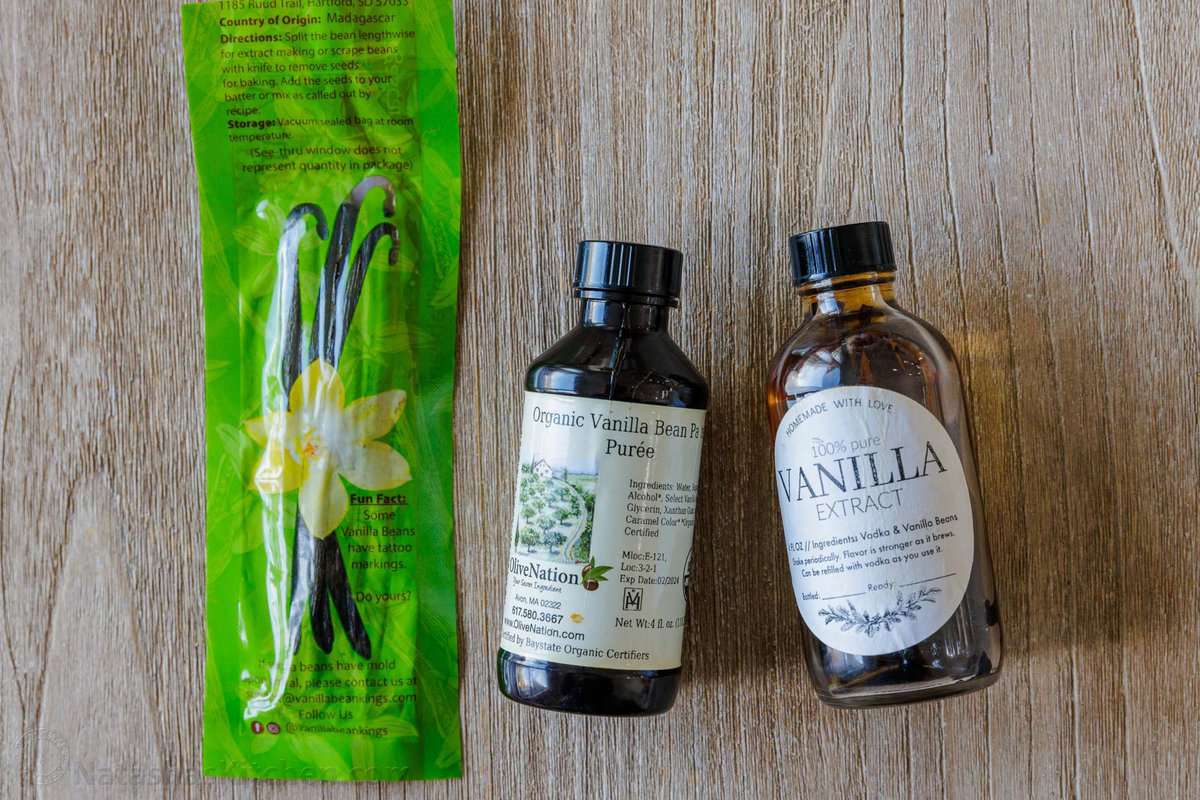 Creme Brulee is an easy dessert recipe made with just 4 ingredients! Learn how to make homemade creme brulee that tastes restaurant-quality. Overhead view of a package of vanilla beans pods next to bottles of vanilla bean paste and pure vanilla extract.