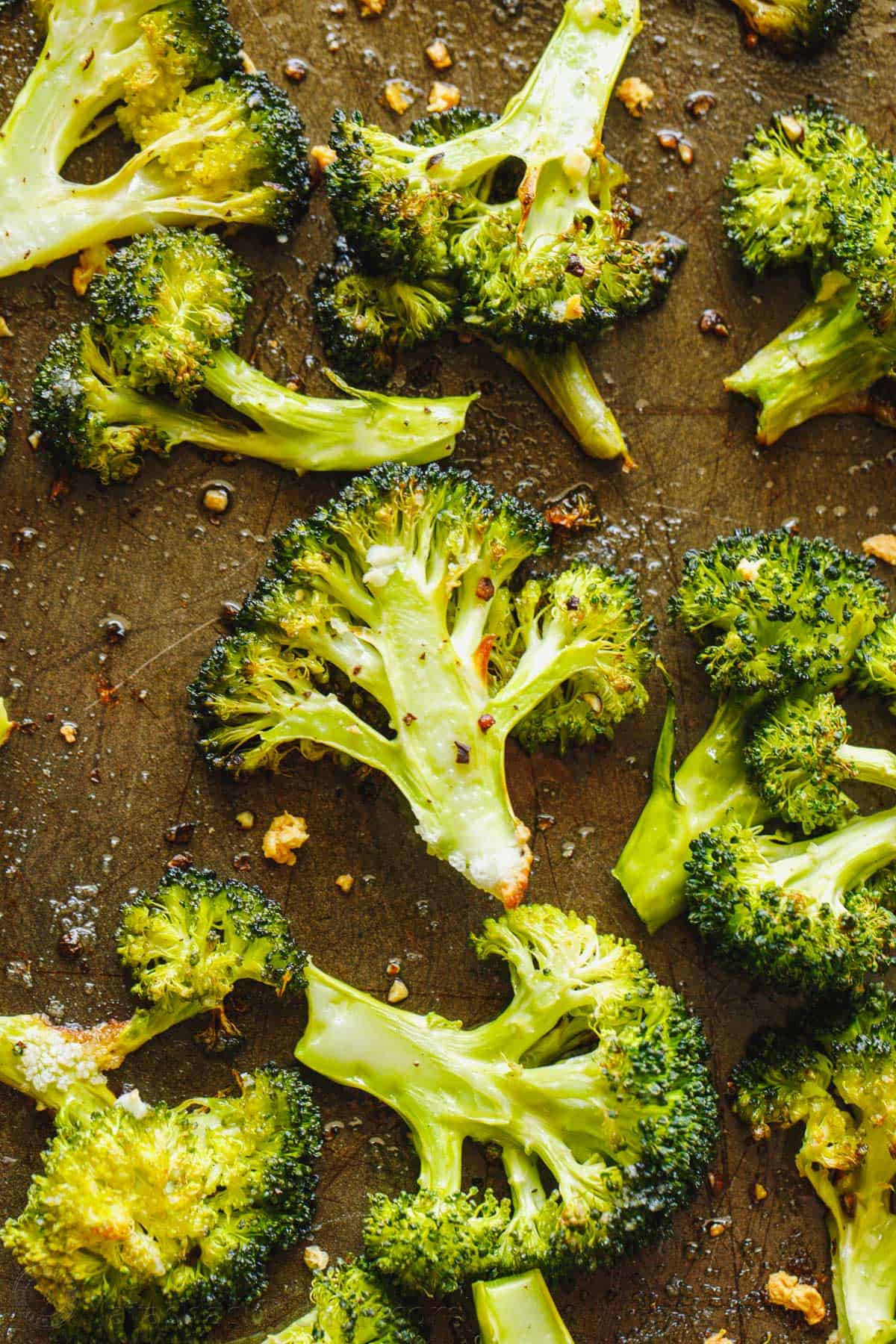 The best way to cook broccoli is roasting them in the oven with oil, seasoning and garlic. Broccoli florets oven roasted on a baking sheet.