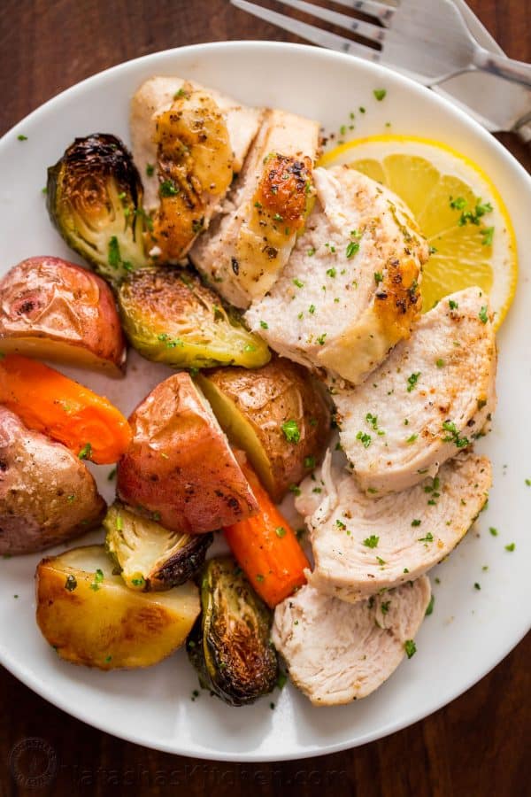 This Spatchcock chicken recipe is our favorite way to roast a whole chicken. Every part of the roasted chicken turns out juicy and so flavorful with that garlic herb butter. Easy and delicious one pan chicken dinner! 