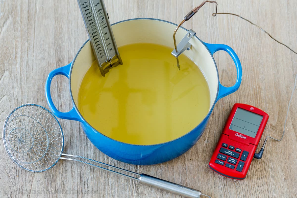 Dutch oven with thermometer set up for frying